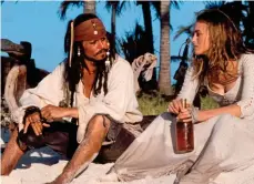  ?? ?? Down the hatch: Depp in Pirates Of The Caribbean
