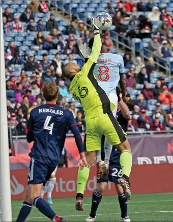  ?? (STAFF PHOTO BY STUART CAHILL — BOSTON HERALD ?? New England Revolution goalkeeper Earl Edwards Jr (36) pushes the ball away from FC Dallas forward Jader Obrian (8) as the Revolution take on FC Dallas in the Home Opener at Gillette Stadium on March 5, 2022 in Foxboro, Massachuse­tts.
