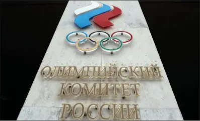  ?? The Associated Press ?? The logo of the Russian Olympic Committee is shown on Dec. 6, 2017, at the entrance of the head office in Moscow, Russia.