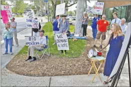  ?? Katharine Lotze/The Signal ?? Opponents of Senate Bill 634, which created the new Santa Clarita Valley Water agency, gather in front of Santa Clarita City Hall before delivering letters to State Senator Scott Wilk’s office on Tuesday, Aug. 1, 2017.