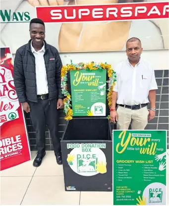  ?? ?? Supporting the programme at 5Five Ways Mall are Senzo Mhlongo and Ravin Tirumol
The donation boxes are clearly marked
