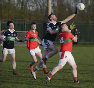  ??  ?? Bray’s Daire Lohan competes with Rathnew’s Mark Doyle during the SFL Division 1 clash in Bray last weekend.