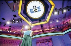  ?? ANDREW HARNIK — THE ASSOCIATED PRESS FILE ?? Siyona Mishra, 11, of Orlando, Fla. gestures while trying to spell “hacek” during the finals of the Scripps National Spelling Bee at National Harbor in Oxon Hill, Md.