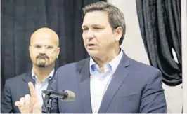  ?? MARTA LAVANDIER/AP ?? Gov. Ron DeSantis speaks at the opening of a monoclonal antibody site on Aug. 18, in Pembroke Pines. DeSantis on Thursday said he will call state lawmakers back to work early to pass legislatio­n to combat coronaviru­s vaccine mandates enacted by businesses.