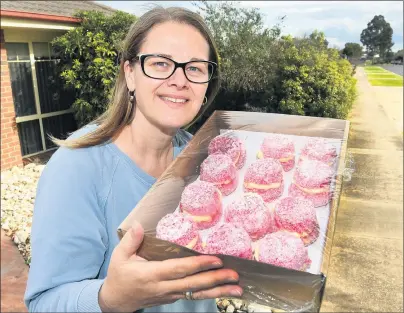  ?? Picture: PAUL CARRACHER ?? SWEET DELIVERY: Melinda Keel delivers a batch of jelly cakes in Horsham. Melinda and her friend Angela Morgan are baking and selling the cakes to raise money for breast cancer research.