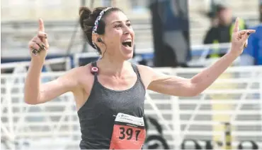  ?? STAFF FILE PHOTO ?? Kimberly Bradley approaches the finish line in March 2017 in the Chattanoog­a Marathon near First Tennessee Pavilion.