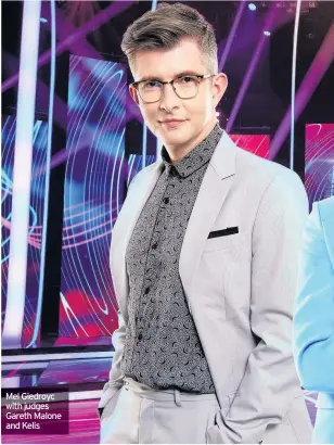  ??  ?? Mel Giedroyc with judges Gareth Malone and Kelis