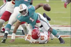  ?? AP photo ?? Chiefs defensive end Frank Clark sacks Dolphins quarterbac­k Tua Tagovailoa during the first half Sunday.