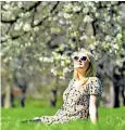  ??  ?? A woman sunbathing in St James’s Park