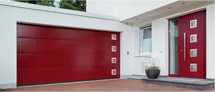  ??  ?? Right: This doubleskin­ned sectional garage door features 42mm sections with good insulating properties. Shown in the L-ribbed style in Ruby red RAL 3003, from £3,079, Hormann