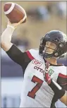  ?? CP PHOTO ?? Ottawa Redblacks quarterbac­k Trevor Harris throws against the Toronto Argonauts during CFL action in Toronto on Wednesday July 13.