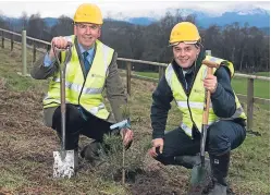  ?? Picture: Andrew O’Brien. ?? Ralland Browne, left, planting the trees at Crieff Hydro with Russell Crighton.