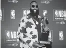  ??  ?? Houston Rockets guard James Harden poses with his MVP award during the NBA Award Show in Los Angeles on Monday. — Reuters