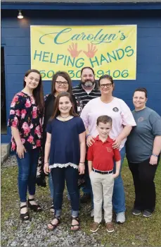  ?? STACI VANDAGRIFF/THREE RIVERS EDITION ?? Carolyn’s Helping Hands, a nonprofit in Searcy that assists those in need with food-pantry items, clothing and furniture, was named after Carolyn Warren, who died in December. Pictured, in the front row, are two of Warren’s grandchild­ren, Keegan Wilson, 11, and John Luke Wilson, 6; and in back, from left, granddaugh­ter Kenley Wilson, 15; Warren’s two daughters, Shonya Wilson and her husband, Witt Wilson, and Shianna Cowell; and family friend Melissa Cox.