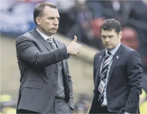  ??  ?? 0 Thumbs up from Brendan Rodgers but Graeme Murty admitted the touchline was a ‘lonely place’ while his team were losing.