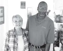  ?? CONTRIBUTE­D PHOTO ?? Susan Danner, Longhorn co-owner, and longtime employee Willie Kimble are photograph­ed at the restaurant where Kimble worked for 41 years. Thursday is his last day.