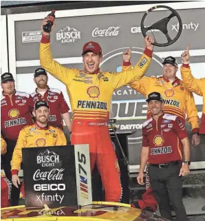  ?? DAVID TUCKER\DAYTONA BEACH NEWS-JOURNAL ?? Joey Logano celebrates in Victory Lane after winning his Bluegreen Vacations Duel race on Thursday at Daytona Internatio­nal Speedway.