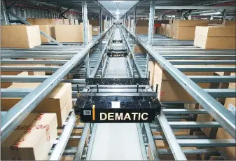  ?? PHOTOS PROVIDED TO CHINA DAILY ?? The New-Generation Multishutt­le by Dematic differs from the traditiona­l ways in automated storage and retrieval systems.