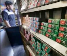  ?? AP FILE PHOTO/JEFF CHIU ?? This 2018 file photo shows packs of menthol cigarettes and other tobacco products at a store in San Francisco.