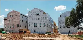  ?? FENCELINE PRODUCTION­S ?? Houston-based InTown Homes is building 71 townhomes off East Riverside Drive, just east of downtown. Buyers have contracted for 53 of the 71 units, which are priced from $534,900 to $800,000, said Wendy Feeley, the community sales manager. The median...