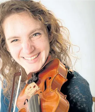  ?? WAYNE EARDLEY/SPECIAL TO THE EXAMINER ?? Violinist Jana Farell prepares for the 2016/2017 concert season with the Peterborou­gh Symphony Orchestra (PSO). On Wednesday Sept. 14, the orchestra is holding open auditions for volunteer musicians interested in playing with the PSO in the upcoming...