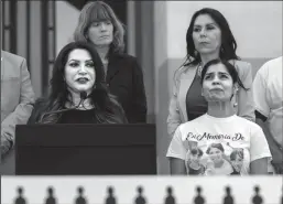  ?? HECTOR AMEZCUA/SACRAMENTO BEE ?? Ileana Gutierrez, wearing a shirt with photograph­s of her three daughters killed in Arden Arcade by father David Mora in February, holds back tears as she appears at a press conference with state Sen. Susan Rubio, D-Baldwin Park, at the state Capitol on Monday. Rubio is sponsoring a bill known as Piqui’s Law, which would force family court judges to learn more about domestic violence, with the aim of applying that to contested custody cases.