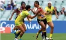  ??  ?? Debbie Kaore of Papua New Guinea takes on the defence in the match against Australia during day one of the 2018 Sydney Sevens at Allianz Stadium. Photograph: Bradley Kanaris/Getty Images