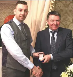  ??  ?? Left: Robert Stack receives his Duhallow Junior A Hurling League medal from Sean Browne, Newmarket Motors, sponsors at the club victory function in the Devon Inn. Right: Brid Stack presents county playing colleague and All Star Deidre O’Reilly with her...