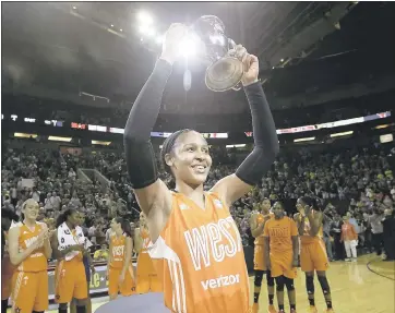  ?? ELAINE THOMPSON - ASSOCIATED PRESS ?? The Western Conference’s Maya Moore holds up the trophy after being named MVP of the WNBA All-Star Game.