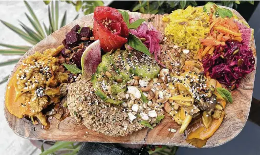  ?? Photos by Mike Sutter / Staff ?? Fermented carrots, beets and red cabbage surround the gravlax board’s sweet and salty salmon with creamy pecan nut cheese.