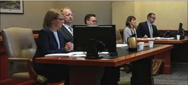  ?? DENISE G. CALLAHAN / STAFF ?? Fired Butler County Regional Airport manager Ron Davis sits between his attorneys Erin Heidrich and George Reul Jr. during a hearing in Common Pleas Judge Keith Spaeth’s courtroom. The county’s attorneys Linda Woeber and Anthony McNamara are seated across the aisle. Davis has sued the county to get his job back.