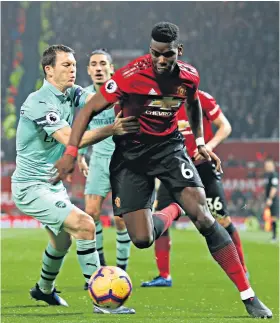  ??  ?? Marked man: Paul Pogba tries to beat Arsenal’s Stephan Lichtstein­er after arriving as a second-half substitute
