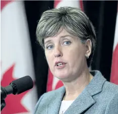  ?? ANDREW VAUGHAN/THE CANADIAN PRESS ?? Internatio­nal Developmen­t Minister Marie-Claude Bibeau talks with reporters before the morning session as the Liberal cabinet meets in St. John’s, N.L. on Tuesday. Bibeau urged Canadians who still need help in the hurricaner­avaged Caribbean to reach...