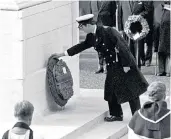  ??  ?? Royal duties: Prince Charles, right, placing a wreath on behalf of the Queen, who was on a state visit, in 1983, and taking her place at the Sovereign’s Parade at Sandhurst in 2015, below left