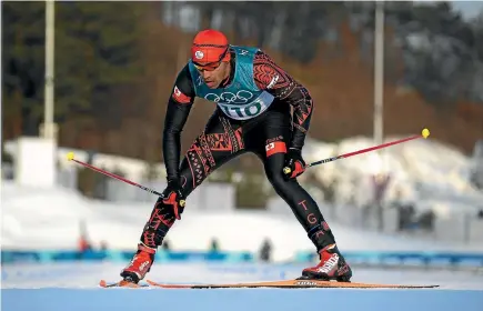  ?? GETTY IMAGES ?? Tonga’s Pita Taufatofua crosses the finish line in the 15km cross-country ski race at PyeongChan­g.