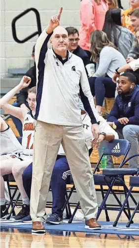  ?? WADE PAYNE PHOTO ?? Summit girls basketball coach John Wild is concerned with added postseason travel that has come with four classes.