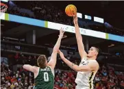  ?? Abbie Parr/associated Press ?? Purdue’s Zach Edey, shooting over Michigan State’s Jaxon Kohler, had 29 points and 12 rebounds.