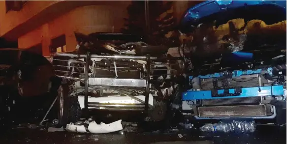  ?? Reuters ?? Damaged vehicles at the site of a car bomb blast in the Mezzah suburb of Damascus. Two people were injured in the incident, state media reported