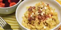  ?? KARON LIU/TORONTO STAR ?? Turos csusza is a simple, four-ingredient Hungarian pasta dish of egg noodles tossed with cheese, sour cream and bacon.