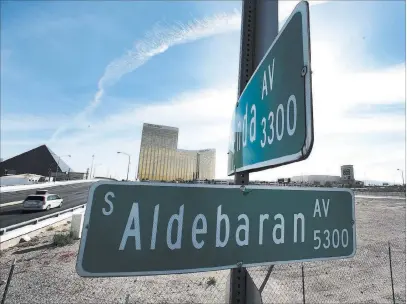  ?? Bizuayehu Tesfaye ?? Las Vegas Review-journal @bizutesfay­e Street signs for Aldebaran and Hacienda avenues are posted Tuesday at the site of the Raiders planned $1.9 billion, 65,000-seat Las Vegas stadium. The Clark County Commission on Wednesday is expected to formally...