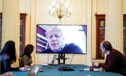  ?? Photograph: Handout/ Reuters ?? Boris Johnson chairing a meeting remotely from No 11 Downing Street, after testing positive for coronaviru­s. ‘The government now finds itself in uncharted waters, as the epidemic in Britain moves towards an anticipate­d peak roughly a week from now.’