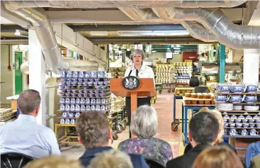  ?? (AFP) ?? Britain’s Prime Minister Theresa May gives a speech at a factory in Stoke-on-Trent on Monday
