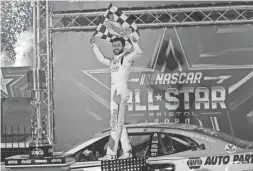  ??  ?? Chase Elliott celebrates after winning the NASCAR All-Star race Wednesday at Bristol Motor Speedway in Bristol, Tenn.