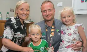  ??  ?? Daddy cool: Team manager Graham Shaw greeted by his family, wife Ali Shaw, and son and daughter Jack and Ellie