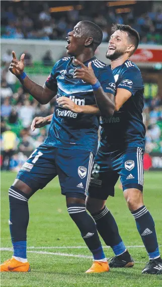  ?? SWEET SUCCESS: Victory players Leroy George and Matias Sanchez celebrate a goal. ??