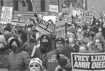  ?? AP ?? People march at a rally for Amir Locke on Feb. 5, in Minneapoli­s. Minnesota prosecutor­s declined to file charges April 6 against a Minneapoli­s police SWAT team officer who fatally shot Locke while executing an early morning no-knock search warrant in a downtown apartment in February.