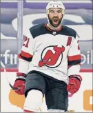  ?? Matt Slocum / Associated Press ?? New Jersey Devils' Kyle Palmieri reacts after scoring a goal during the first period vs. the Philadelph­ia Flyers Tuesday in Philadelph­ia.