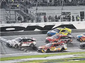  ?? PHELAN M. EBENHACK THE ASSOCIATED PRESS FILE PHOTO ?? Austin Cindric takes the checkered flag in front of Bubba Wallace to win the 2022 Daytona 500. A new season gets underway this weekend, but a lack of star power has some worried about the sport.