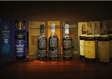  ??  ?? This page: vintage Macallans and the sought-after Black Bowmore collection; Rare Finds Worldwide’s Freeman Ho
Opposite page:
Scotch malts are matured in oak casks for a minimum of three years; expect to pay upwards of US$25,000 for a 1966 Bowmore