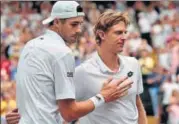  ?? AP ?? The marathon semifinal contest between Kevin Anderson (right) and John Isner disrupted the schedule of the final weekend.